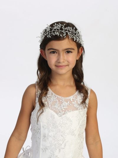 Girl wearing a silver crystal crown with branch design for communion.