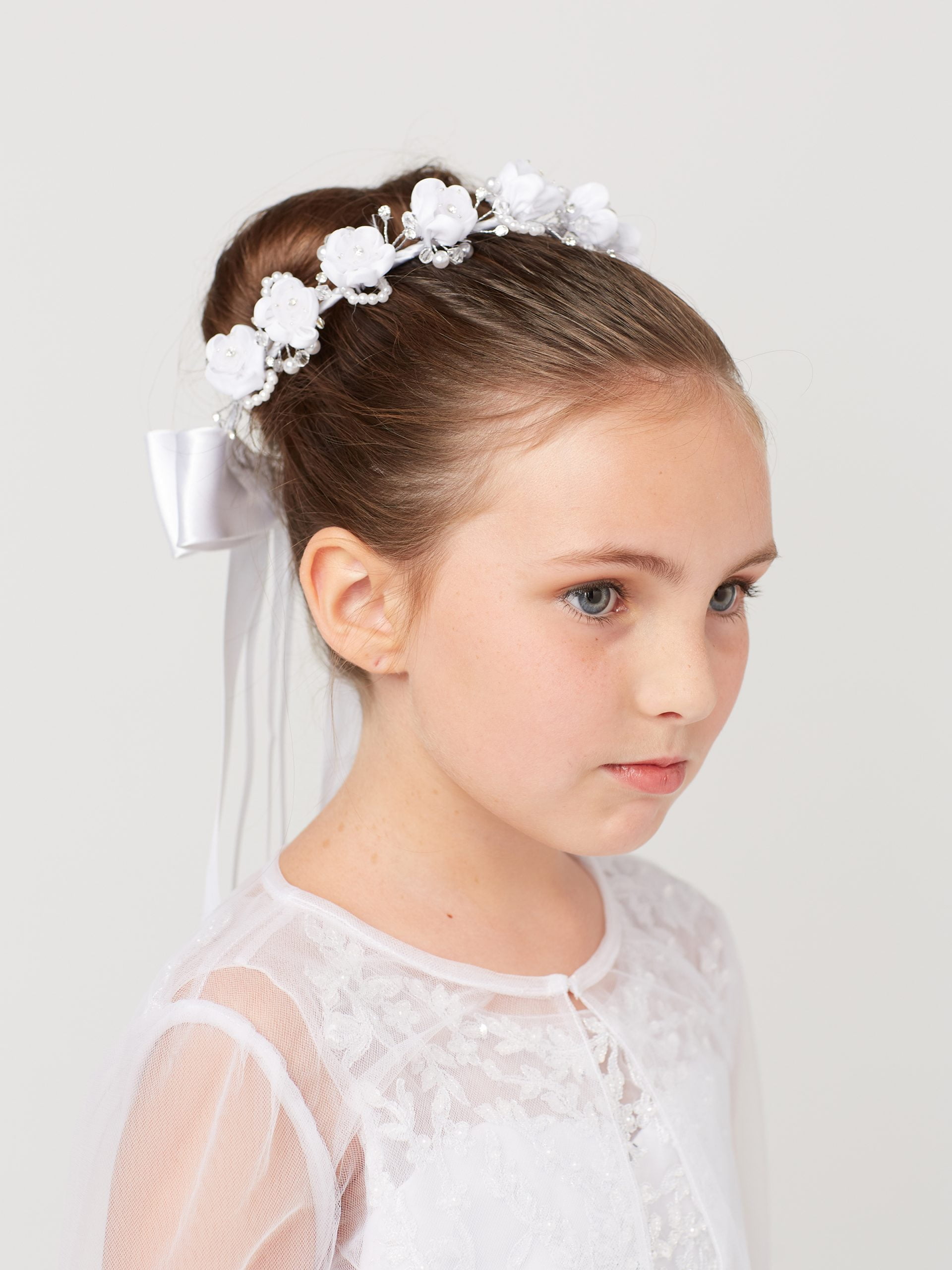 537 Girls Communion Flower Crown with small white flowers, pearls, and ribbon bow.