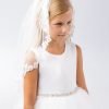 LUZ 1 Girl wearing a girls communion veil lace design with floral trim.