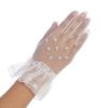 Delicate girls gloves in white mesh with bead accents and a ruffle cuff, perfect for communion or flower girl dresses.